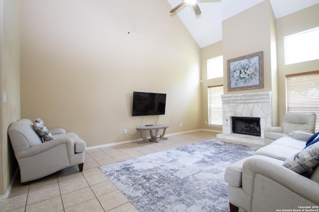 8219 Wayside Crk, San Antonio, TX 78255 - living area featuring high vaulted ceiling, light tile patterned flooring, a ceiling fan, a fireplace, and baseboards