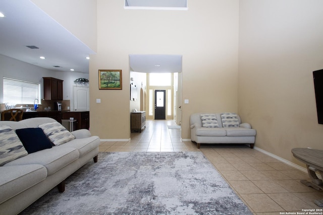 8219 Wayside Crk, San Antonio, TX 78255 - living area with light tile patterned flooring, baseboards, a towering ceiling, and recessed lighting