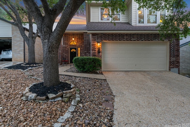 6431 Brookway, San Antonio, TX 78240 - view of front of house with brick siding, concrete driveway, an attached garage, and a shingled roof