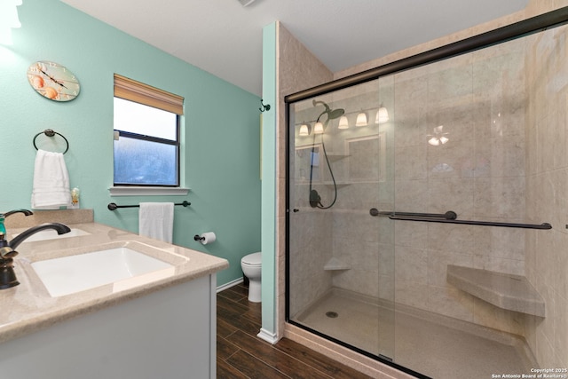 6431 Brookway, San Antonio, TX 78240 - full bath featuring a shower stall, toilet, vanity, wood finished floors, and baseboards