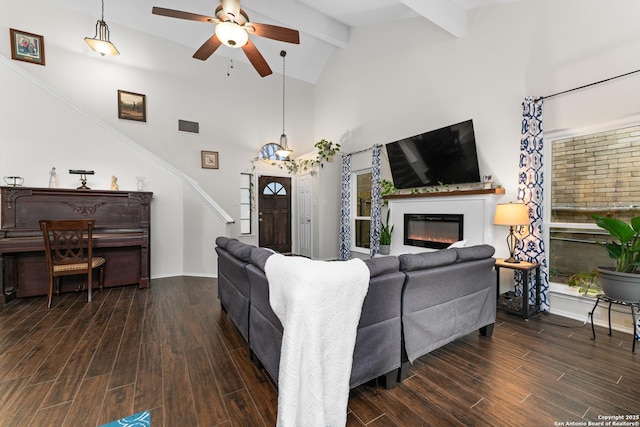 6431 Brookway, San Antonio, TX 78240 - living area featuring a ceiling fan, a glass covered fireplace, wood finished floors, beam ceiling, and high vaulted ceiling
