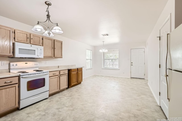 9215 Granberry, Universal City, TX 78148 - kitchen with white appliances, a chandelier, light countertops, decorative light fixtures, and light brown cabinetry