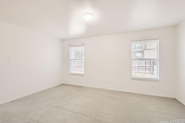 9215 Granberry, Universal City, TX 78148 - empty room with healthy amount of natural light, carpet floors, and baseboards