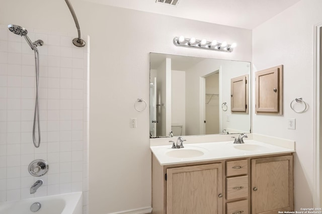 9215 Granberry, Universal City, TX 78148 - bathroom featuring double vanity and shower / tub combination