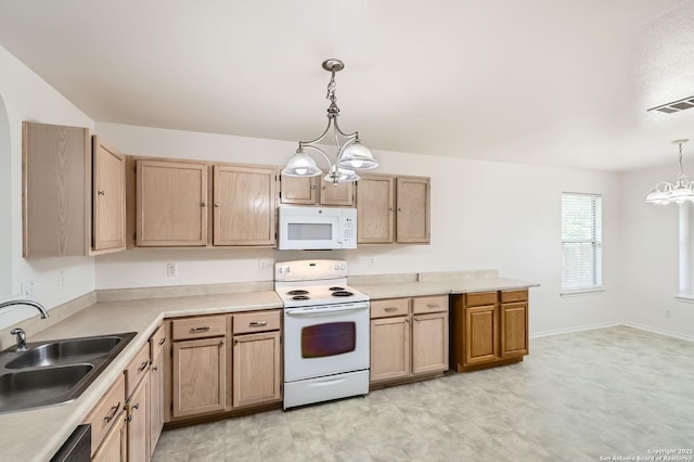 9215 Granberry, Universal City, TX 78148 - kitchen with white appliances, a chandelier, a sink, and light brown cabinetry
