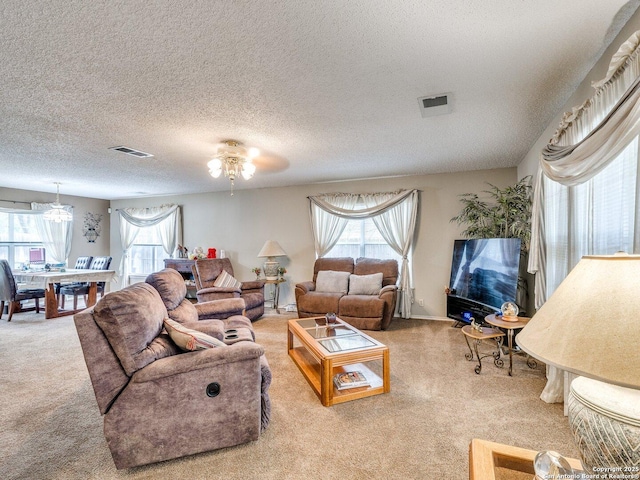 9427 Wildstone, San Antonio, TX 78254 - living area with carpet floors and a textured ceiling