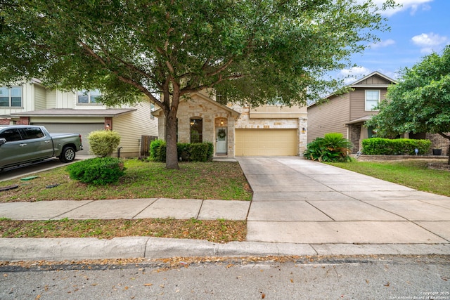 10228 Ancient Anchor, San Antonio, TX 78245 - view of front facade featuring driveway, a garage, and stone siding