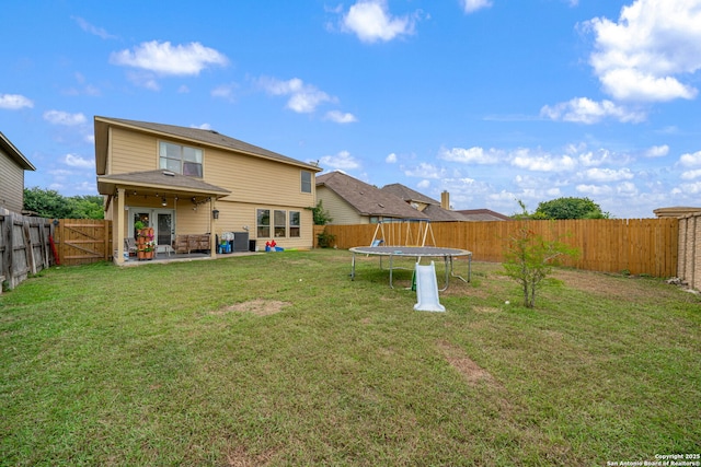 10228 Ancient Anchor, San Antonio, TX 78245 - back of property with a trampoline and a patio area