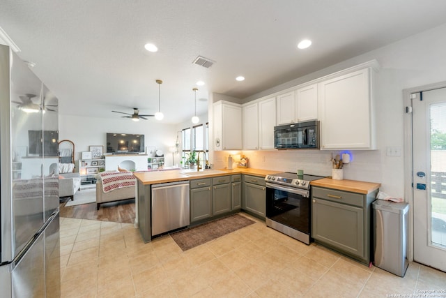 10228 Ancient Anchor, San Antonio, TX 78245 - kitchen with stainless steel appliances, a sink, ceiling fan, wood counters, and gray cabinetry