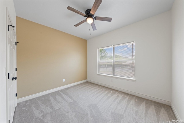 712 Gilmer, Kerrville, TX 78028 - empty room featuring light carpet, baseboards, and ceiling fan