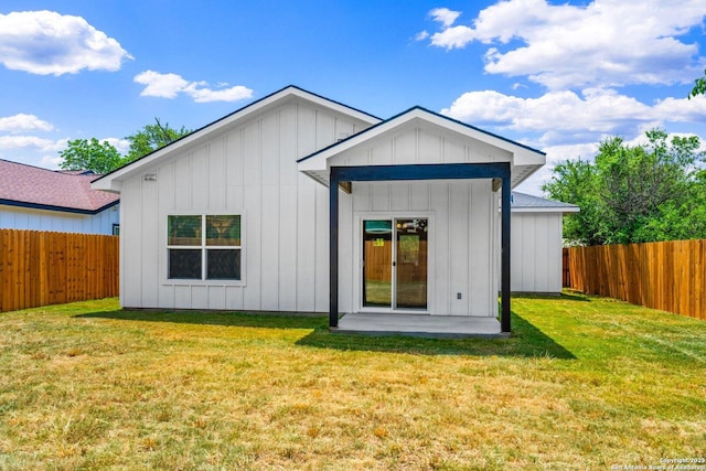 712 Gilmer, Kerrville, TX 78028 - rear view of property featuring board and batten siding and a patio area