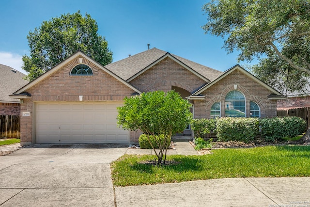 2710 Trinity Rdg, San Antonio, TX 78261 - ranch-style home featuring brick siding, driveway, roof with shingles, and an attached garage