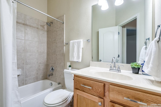 2710 Trinity Rdg, San Antonio, TX 78261 - bathroom featuring shower / bath combo with shower curtain, toilet, vanity, and a textured wall