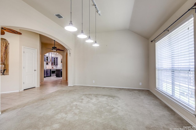 2710 Trinity Rdg, San Antonio, TX 78261 - unfurnished room with arched walkways, lofted ceiling, light colored carpet, healthy amount of natural light, and a ceiling fan