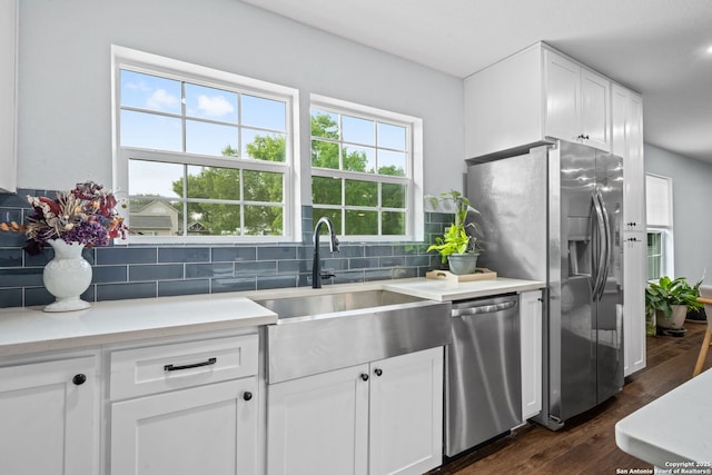 108 Bryn Mawr Dr, San Antonio, TX 78209 - kitchen featuring stainless steel appliances, a sink, tasteful backsplash, dark wood-type flooring, and plenty of natural light
