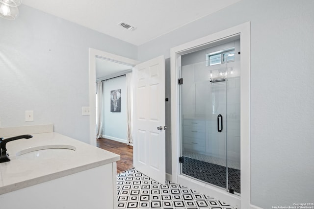 108 Bryn Mawr Dr, San Antonio, TX 78209 - bathroom featuring a shower stall, vanity, and baseboards