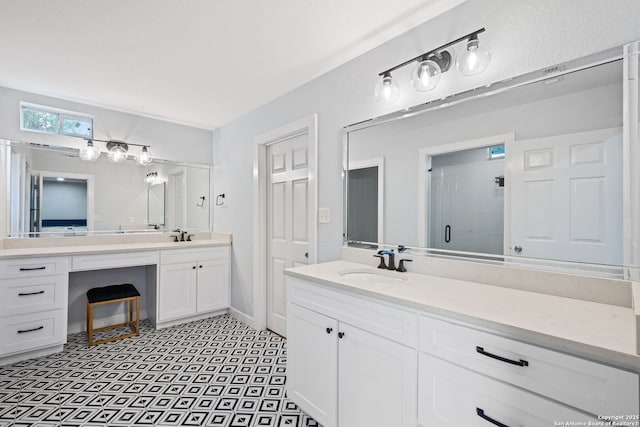 108 Bryn Mawr Dr, San Antonio, TX 78209 - bathroom with a shower stall, vanity, and baseboards
