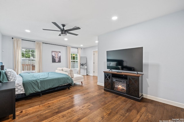 108 Bryn Mawr Dr, San Antonio, TX 78209 - bedroom featuring wood finished floors, recessed lighting, baseboards, a glass covered fireplace, and a ceiling fan