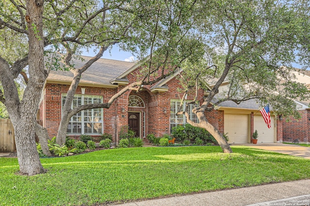 28 Cutter Grn, San Antonio, TX 78248 - view of front of house with brick siding, a garage, a front yard, and driveway