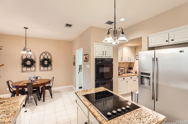 28 Cutter Grn, San Antonio, TX 78248 - kitchen featuring black appliances, a chandelier, decorative backsplash, a center island, and pendant lighting