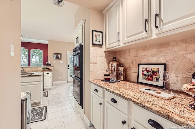 28 Cutter Grn, San Antonio, TX 78248 - kitchen with backsplash, light tile patterned flooring, and white cabinetry