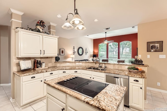 28 Cutter Grn, San Antonio, TX 78248 - kitchen with black electric cooktop, stainless steel dishwasher, a sink, a peninsula, and light tile patterned floors