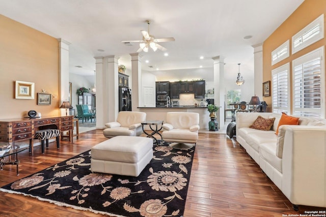8611 Torry Vw, Houston, TX 77095 - living room with decorative columns, a ceiling fan, and hardwood / wood-style floors