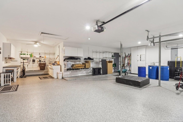 8611 Torry Vw, Houston, TX 77095 - garage with a garage door opener and a ceiling fan