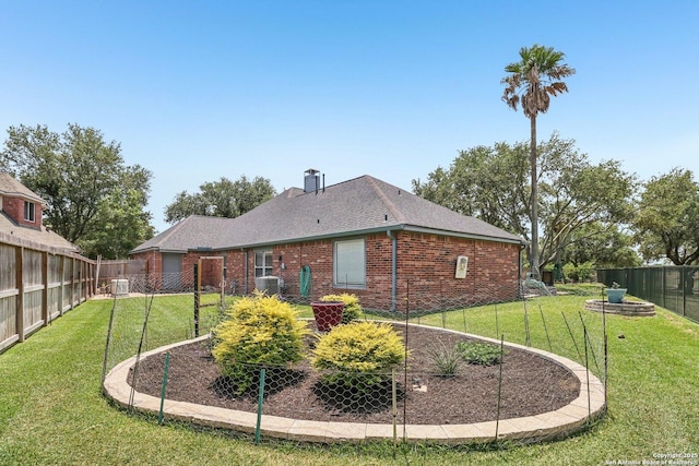 8611 Torry Vw, Houston, TX 77095 - back of property with brick siding, a chimney, roof with shingles, and central AC