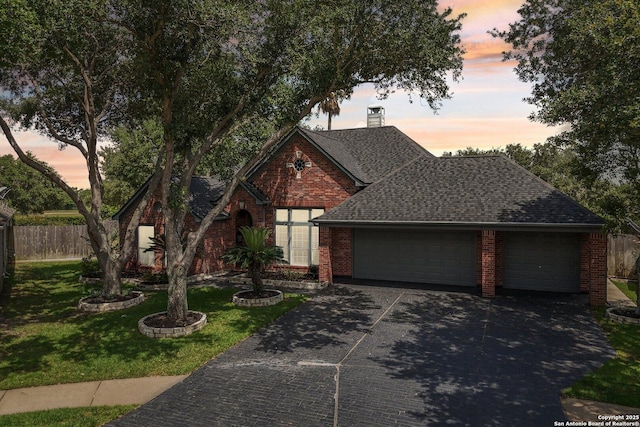 8611 Torry Vw, Houston, TX 77095 - view of front of house featuring brick siding, an attached garage, a shingled roof, driveway, and a chimney