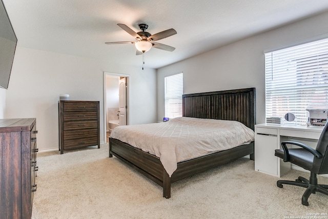 13323 Spike Rush, San Antonio, TX 78254 - bedroom featuring light carpet, connected bathroom, ceiling fan, and a desk