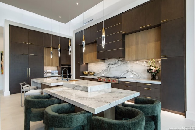 24607 Cliff Line, San Antonio, TX 78257 - kitchen with modern cabinets, a breakfast bar area, tasteful backsplash, and an island with sink