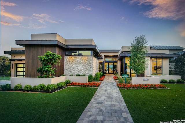 24607 Cliff Line, San Antonio, TX 78257 - contemporary house featuring a front lawn, a standing seam roof, metal roof, stucco siding, and stone siding