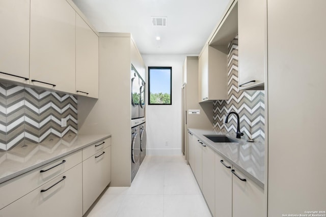 24607 Cliff Line, San Antonio, TX 78257 - kitchen featuring a sink, decorative backsplash, light countertops, light tile patterned floors, and baseboards