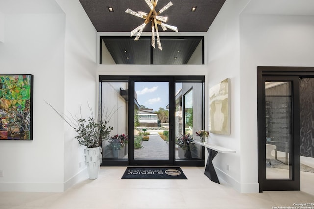 24607 Cliff Line, San Antonio, TX 78257 - entryway with a chandelier, baseboards, and tile patterned flooring