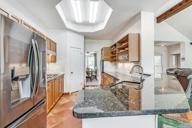 121 Maderas, Seguin, TX 78155 - kitchen with appliances with stainless steel finishes, a sink, open shelves, decorative backsplash, and dark stone countertops