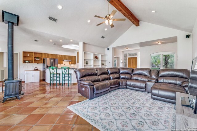 121 Maderas, Seguin, TX 78155 - living area with a wood stove, high vaulted ceiling, a ceiling fan, beamed ceiling, and recessed lighting