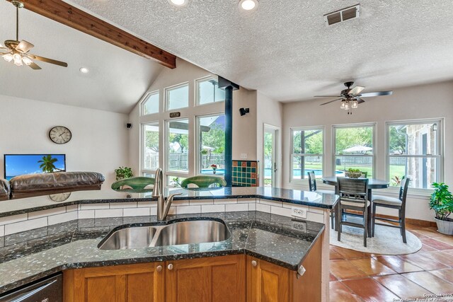 121 Maderas, Seguin, TX 78155 - kitchen featuring a sink, brown cabinetry, dishwashing machine, ceiling fan, and recessed lighting