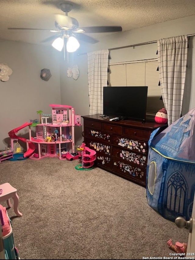 13218 Huntsman Rd, San Antonio, TX 78249 - recreation room featuring carpet floors, a textured ceiling, and ceiling fan