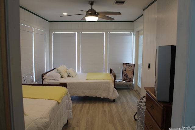 38 Peggy, Palacios, TX 77465 - bedroom featuring light wood finished floors, crown molding, a ceiling fan, and recessed lighting