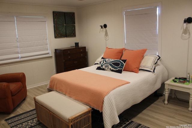 38 Peggy, Palacios, TX 77465 - bedroom with wood finished floors, baseboards, and ornamental molding