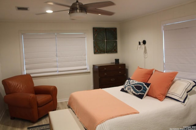 38 Peggy, Palacios, TX 77465 - bedroom featuring wood finished floors, ornamental molding, a ceiling fan, and baseboards