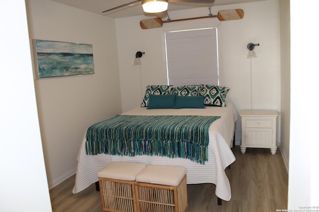 38 Peggy, Palacios, TX 77465 - bedroom with wood finished floors, baseboards, and ceiling fan