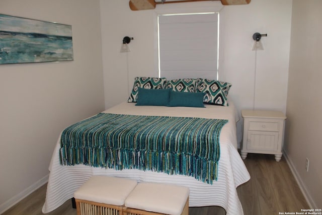 38 Peggy, Palacios, TX 77465 - bedroom featuring wood finished floors and baseboards