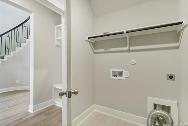 1411 Arcas Way, San Antonio, TX 78245 - washroom with washer hookup, electric dryer hookup, light wood-type flooring, baseboards, and gas dryer hookup