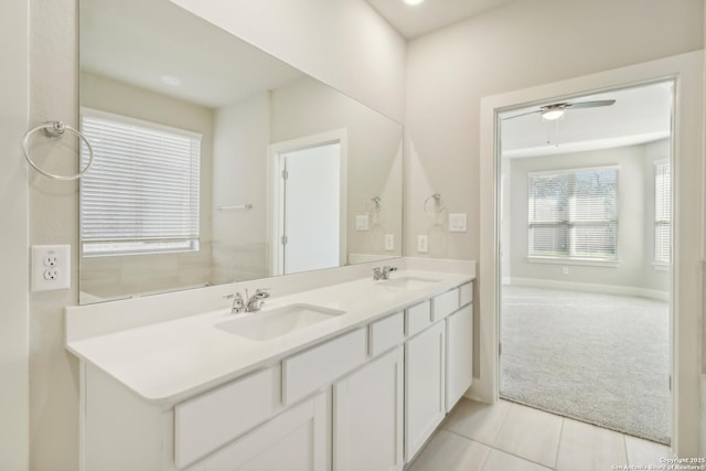 1411 Arcas Way, San Antonio, TX 78245 - bathroom with double vanity, tile patterned flooring, ceiling fan, and baseboards