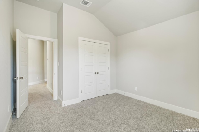 1411 Arcas Way, San Antonio, TX 78245 - unfurnished bedroom with carpet, vaulted ceiling, baseboards, and a closet