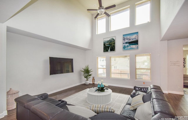14139 Sam Houston, San Antonio, TX 78253 - living room with ceiling fan, a towering ceiling, baseboards, and wood finished floors