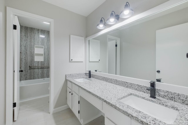6518 Spring Hurst Dr, San Antonio, TX 78249 - full bathroom with double vanity, shower / bathtub combination, tile patterned floors, and baseboards