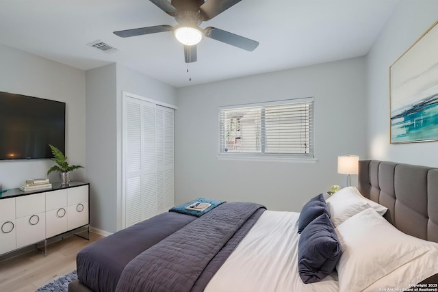 6518 Spring Hurst Dr, San Antonio, TX 78249 - bedroom with wood finished floors, a closet, a ceiling fan, and baseboards